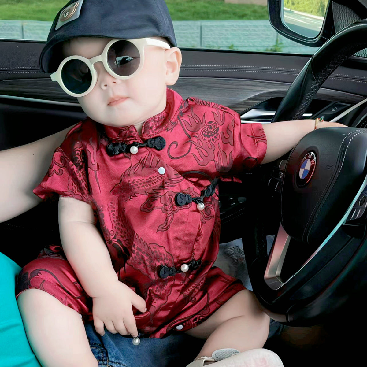 Baby wearing the Baby Boy Red Hanfu red Hanfu-style romper