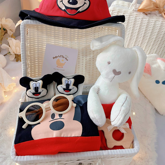 Baby Mickey premium baby gift set in a rattan basket with red and black mouse-themed romper