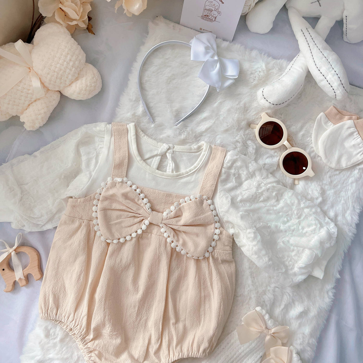 Buttercream Angel baby outfit styling – cream long-sleeve romper