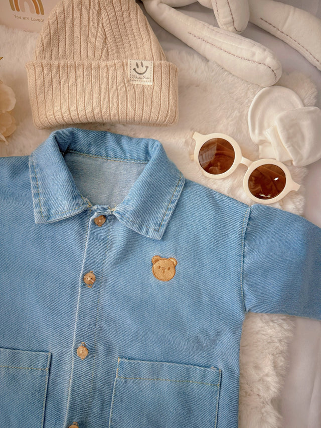 Little Denim Bear baby outfit flat lay – denim romper with bear badge and knit beanie