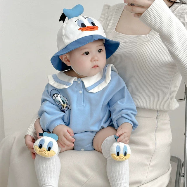 Baby wearing Little Ducky romper – unisex baby outfit from premium gift set