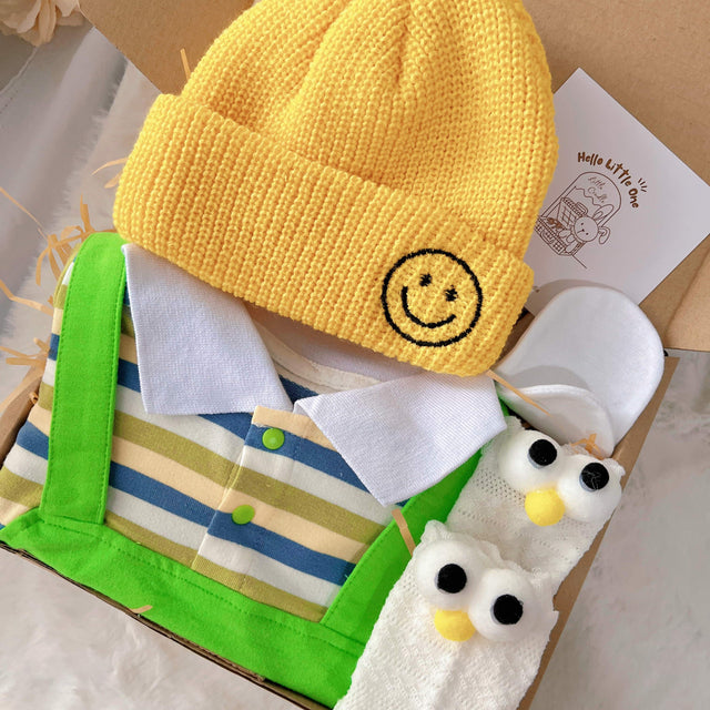 Little Green Sprout standard baby gift box with green striped romper with yellow hat