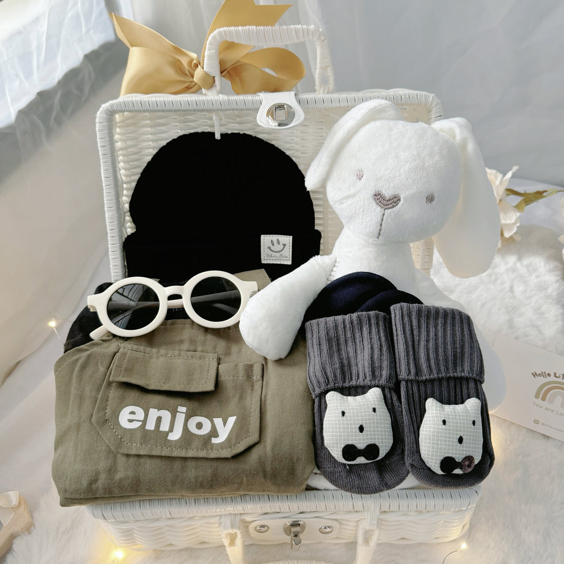 Mini Militia Green premium baby gift set in a rattan basket with black romper with green jacket and hat