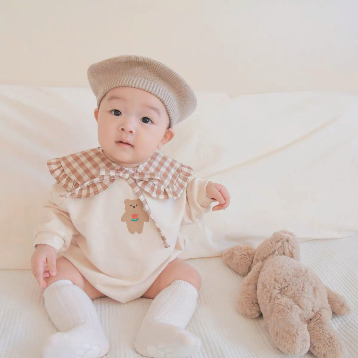 Baby wearing the Sweater Bear long-sleeve bear sweater romper