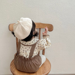 Back view of a baby girl in Autumn Princess romper – cosy newborn gift set