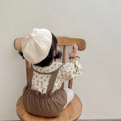 Back view of a baby girl in Autumn Princess romper – cosy newborn gift set