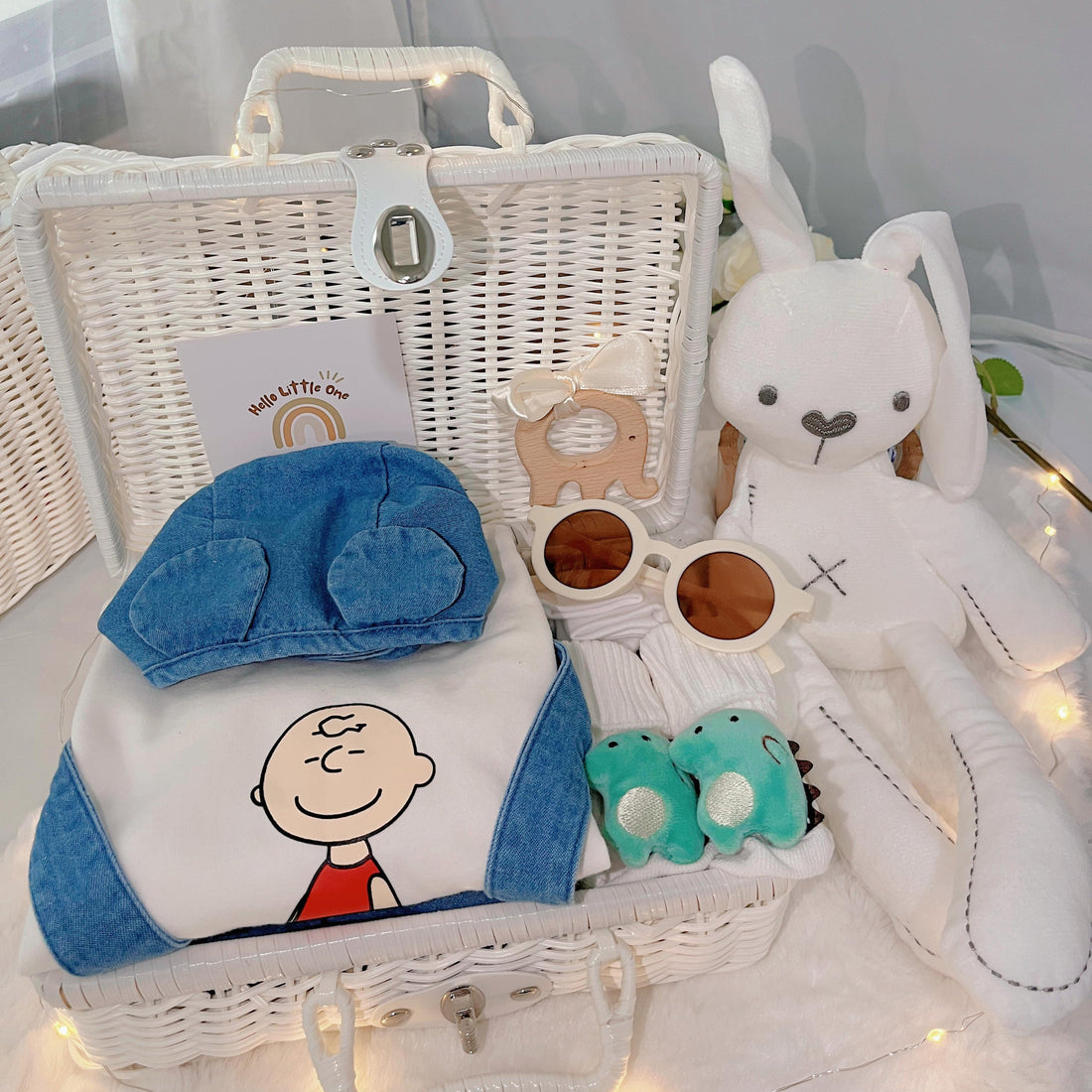 Baby Charlie Brown premium baby gift set in a rattan basket with cartoon-style romper