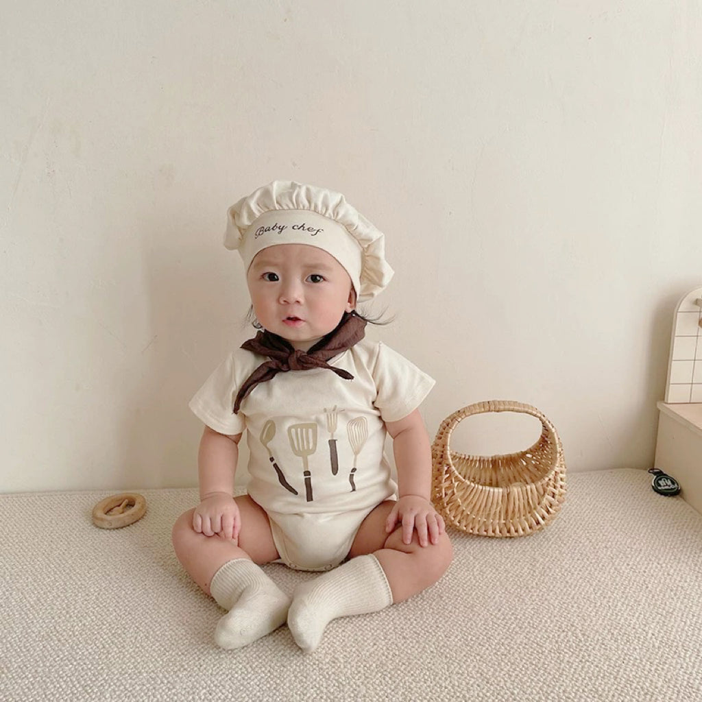 Baby wearing the Baby Chef chef romper with matching hat and bib