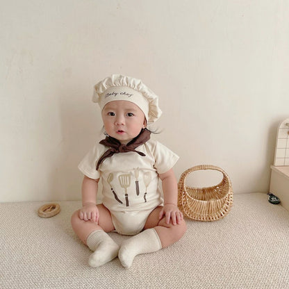 Baby wearing the Baby Chef chef romper with matching hat and bib