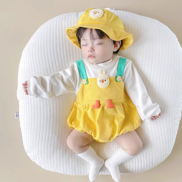 Baby wearing the Baby Chicky yellow chick romper
