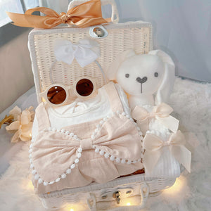 Buttercream Angel premium baby gift set in a rattan basket with cream long-sleeve romper
