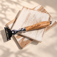Personalised olive wood razor with engraved name and leather pouch