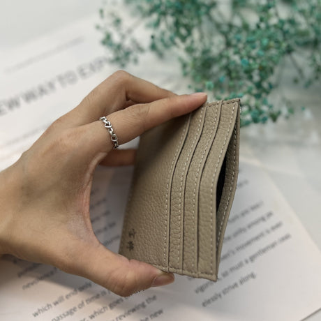 Personalised taupe leather name card holder held in hand, By Glee