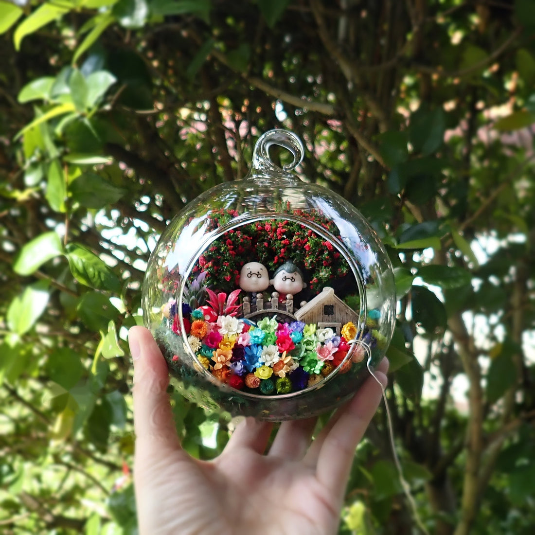 Elderly Couple with House preserved flower terrarium