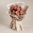 Adore Cappuccino Rose Bouquet by CC Flora, cappuccino roses in khaki wrapping, photographed in a neutral studio.