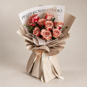 Adore Cappuccino Rose Bouquet by CC Flora, cappuccino roses in khaki wrapping, photographed in a neutral studio.