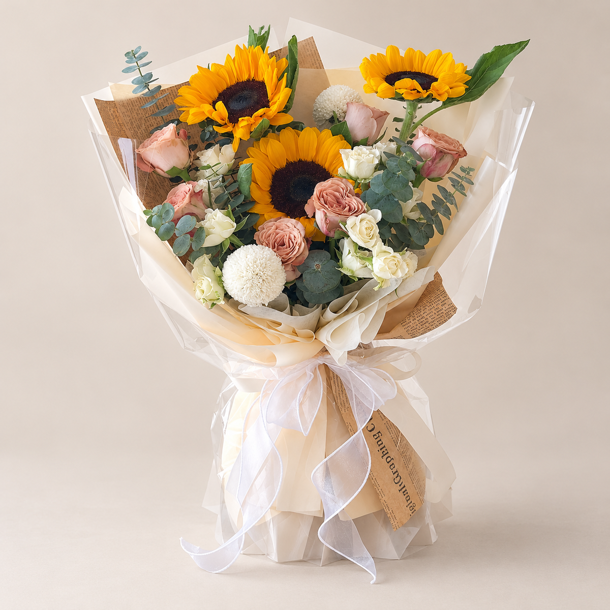 Saffron Cappuccino Sunflower & Rose Bouquet — professional studio product photograph.