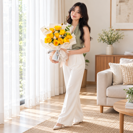 Shine Bright Yellow Rose Bouquet held by the same recipient in a wider standing pose.
