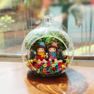 Girls in Blue and Pink Hats preserved flower terrarium