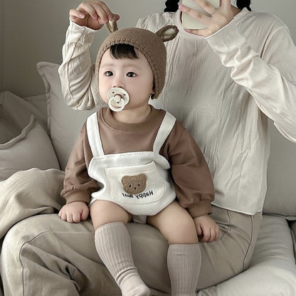 Baby wearing the Happy Bear bear overall romper with bear-ear knit hat