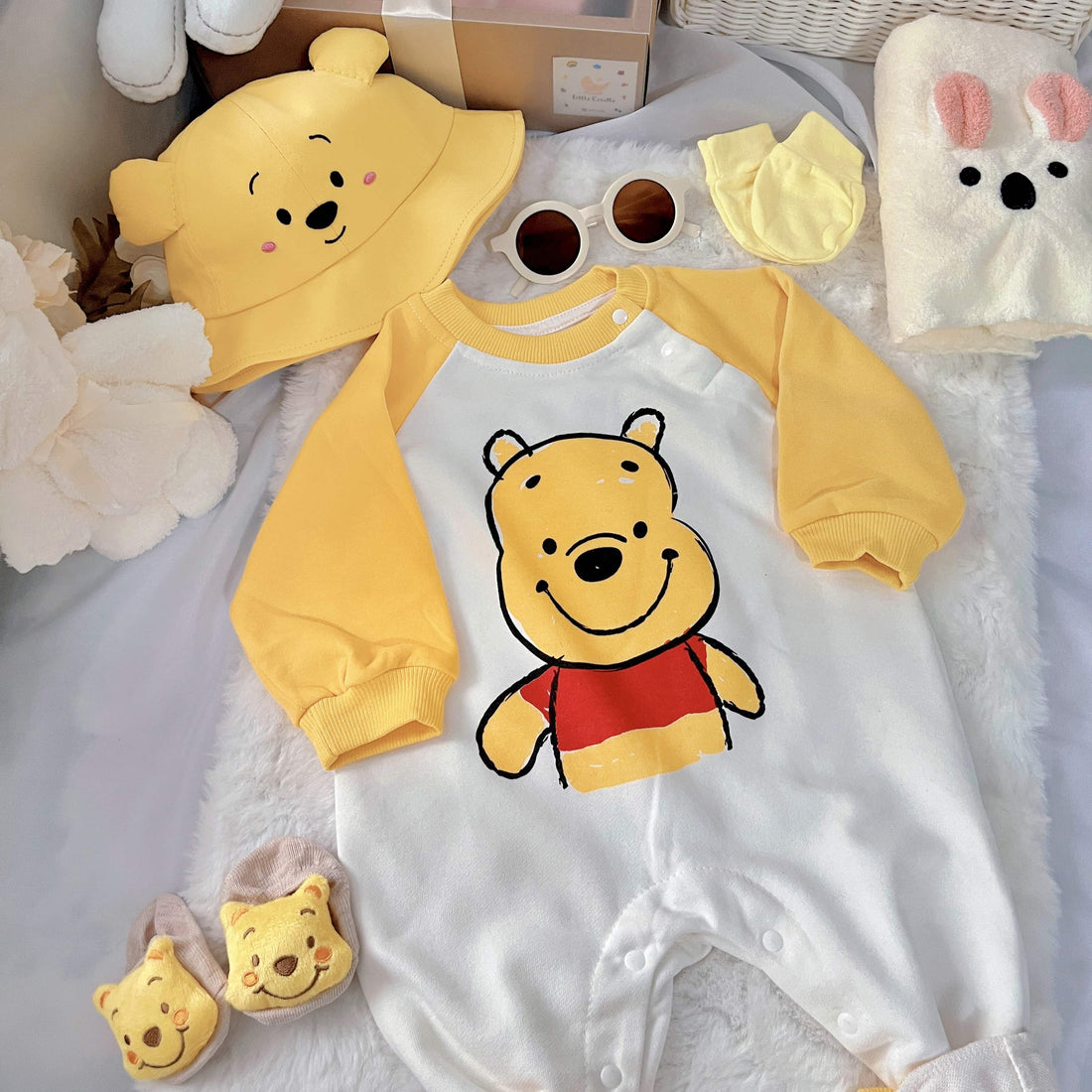 Honey Bunch baby outfit styling – yellow honey-bear romper with hat and socks
