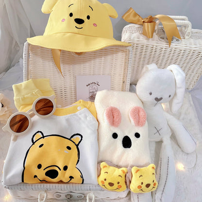 Honey Bunch premium baby gift set in a rattan basket with yellow honey-bear romper with hat and socks