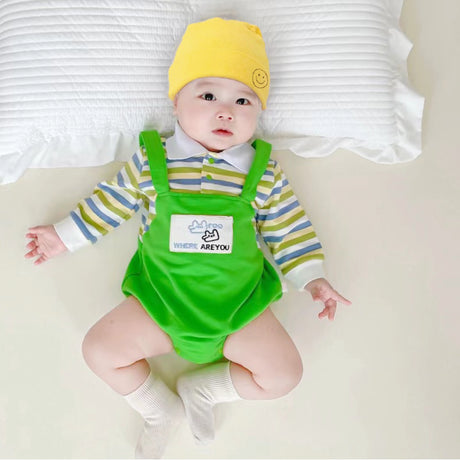 Baby wearing the Little Green Sprout green striped romper with yellow hat