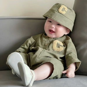 Baby wearing the Little Tiny Trooper army-green romper