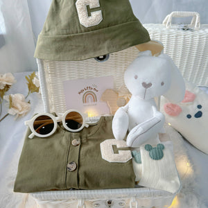 Little Tiny Trooper premium baby gift set in a rattan basket with army-green romper