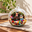 Boy and Girl Preserved Flower Terrarium styled in a natural home setting with clear glass and product details