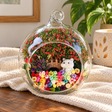 Cat with Fish Preserved Flower Terrarium styled in a natural home setting with clear glass and product details