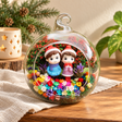 Christmas Couple with Hats Preserved Flower Terrarium styled in a natural home setting with clear glass and product details