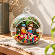 Girls in Blue and Pink Hats Preserved Flower Terrarium styled in a natural home setting with clear glass and product details