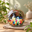 Grey and Blue Figures Flower Terrarium styled in a natural home setting with clear glass and product details