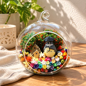 Grey Figure with Umbrella Terrarium styled in a natural home setting with clear glass and product details