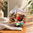 Kissing Couple Preserved Flower Terrarium styled in a natural home setting with clear glass and product details