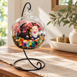 Longevity God Preserved Flower Terrarium styled in a natural home setting with clear glass and product details