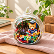 Orange Graduation Bear Preserved Flower Terrarium styled in a natural home setting with clear glass and product details