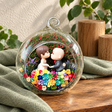 Playful Couple Preserved Flower Terrarium styled in a natural home setting with clear glass and product details
