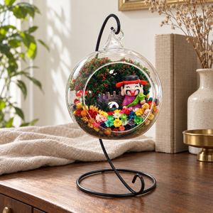 Prosperity God in Purple Preserved Flower Terrarium styled in a natural home setting with clear glass and product details