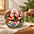 Santa Couple Preserved Flower Terrarium styled in a natural home setting with clear glass and product details