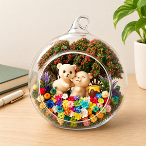 Two Bears preserved flower terrarium styled on a pale wooden desk