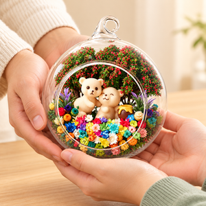 Hands offering the Two Bears preserved flower terrarium as a gift