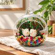 Two Sheep Preserved Flower Terrarium styled in a natural home setting with clear glass and product details