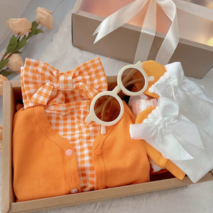 Orange Buttercup classic baby gift box with orange romper and cardigan