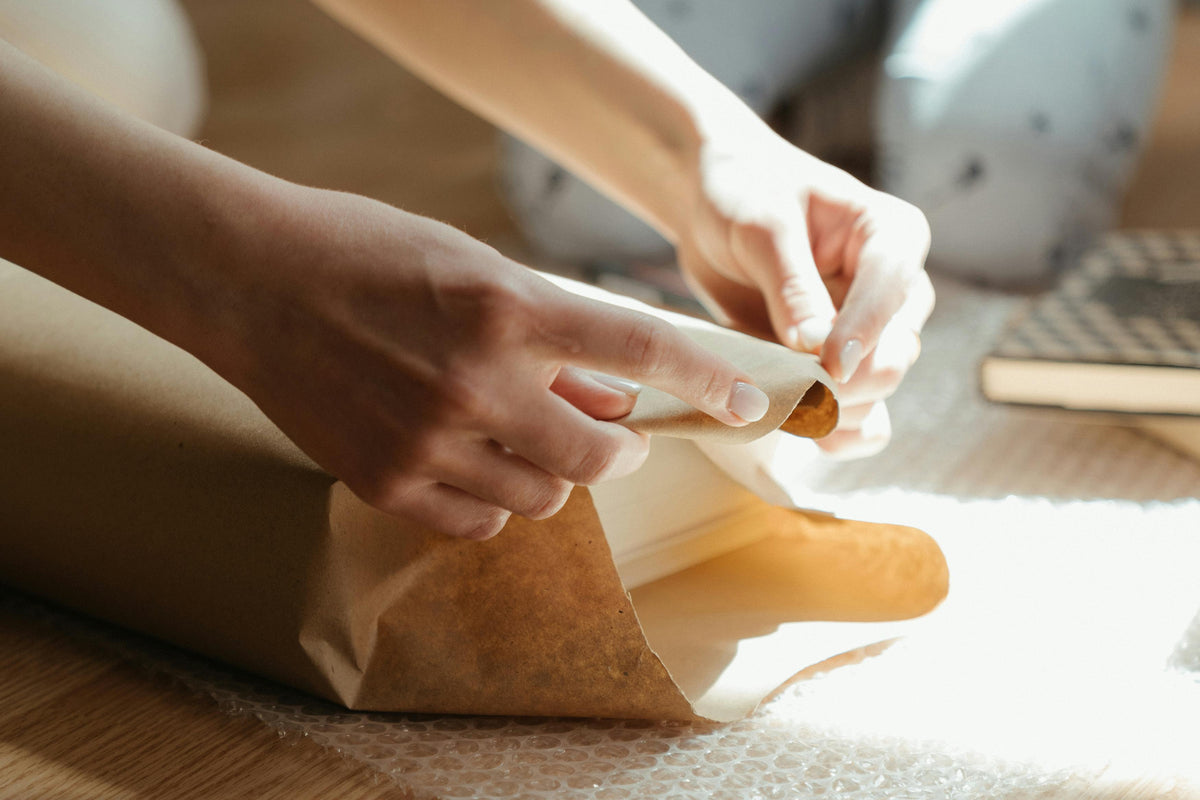 Wrapping a gift in kraft paper