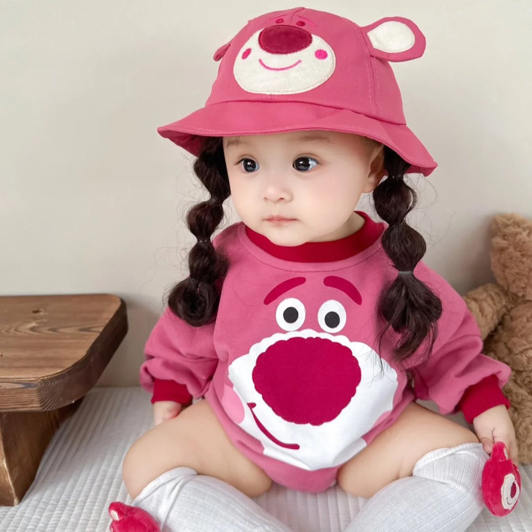 Baby wearing the Pink Pals Lotso pink bear-themed romper