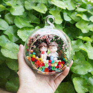 Sitting Couple in Garden preserved flower terrarium
