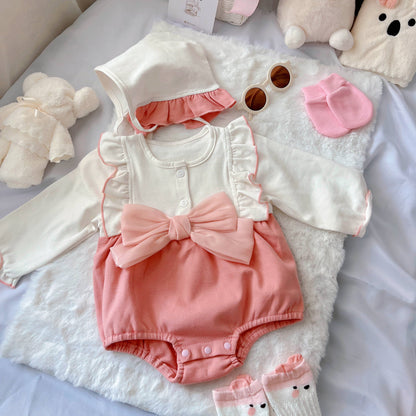 Strawberry Mochi baby outfit styling – pink romper with ribbon accent