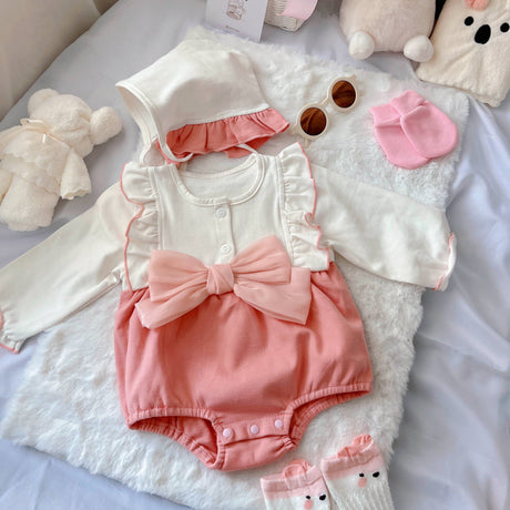 Strawberry Mochi baby outfit styling – pink romper with ribbon accent